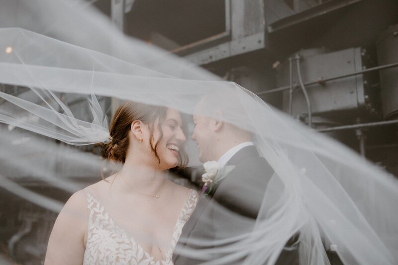 two newly married lgbt brides an celebrate in front of their ceremony locomotive taken by a Vancouver WA wedding photographer