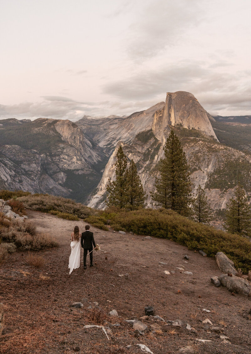 A couple poses on a bridge during their Montana elopement.