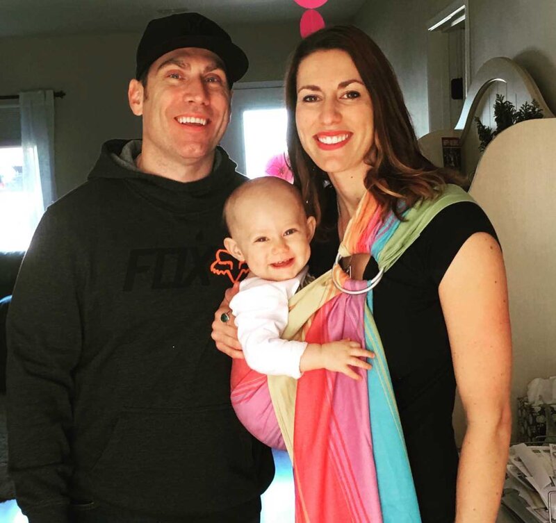 Emily with her husband and 1 year old daughter