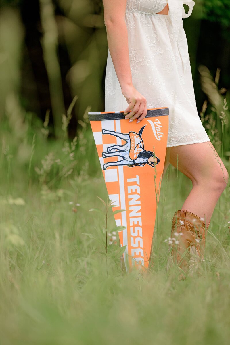 university of tennessee pennant held by Marvin grad during  her senior session