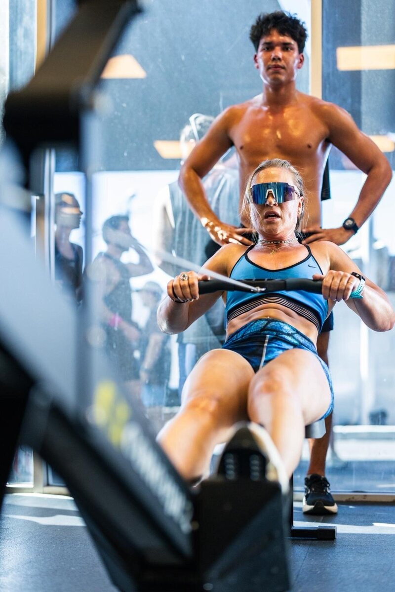 a female in a fitness competition lifting weights