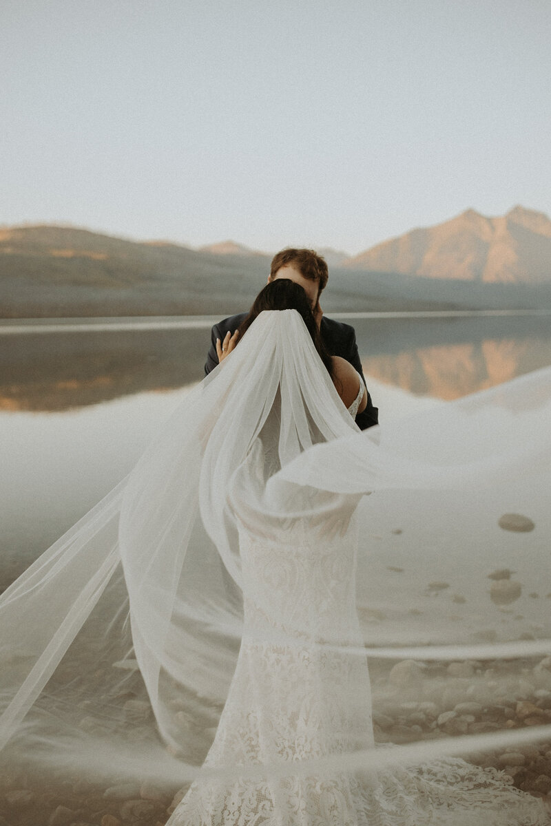 bride and groom kissing during intimate wedding in montana