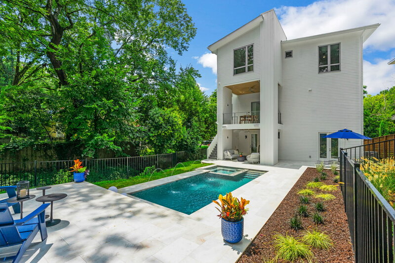 modern pool with white marble pool deck