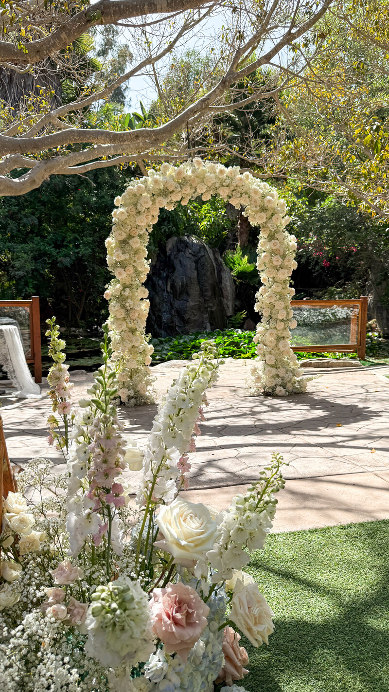 Bride and groom walking down the aisle taking portraits at the San Diego Zoo Safari Park in Escondido, California.