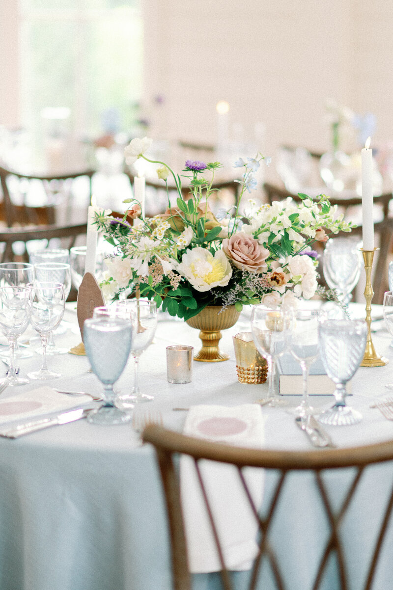 French Blue linen with blue water goblets for high end wedding
