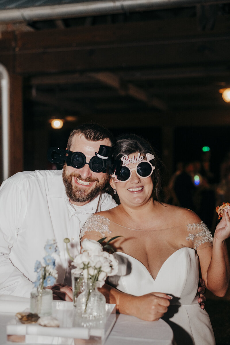 couple posing with glasses