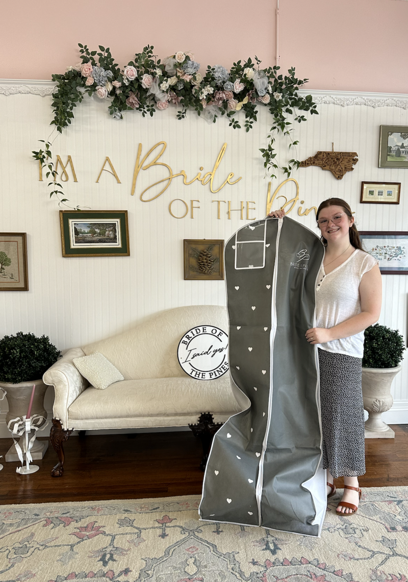bride with her wedding dress from bride of the pines