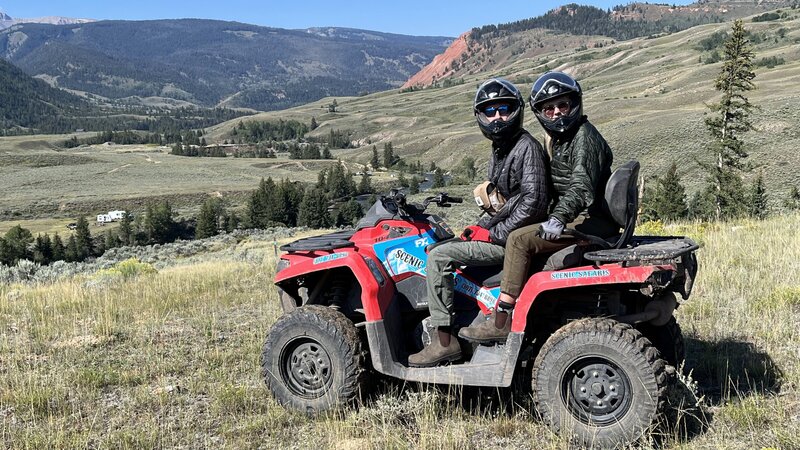 Man and woman on RV with helmets