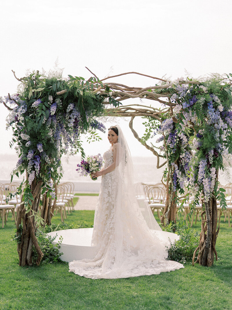 Bride under chuppah near the water