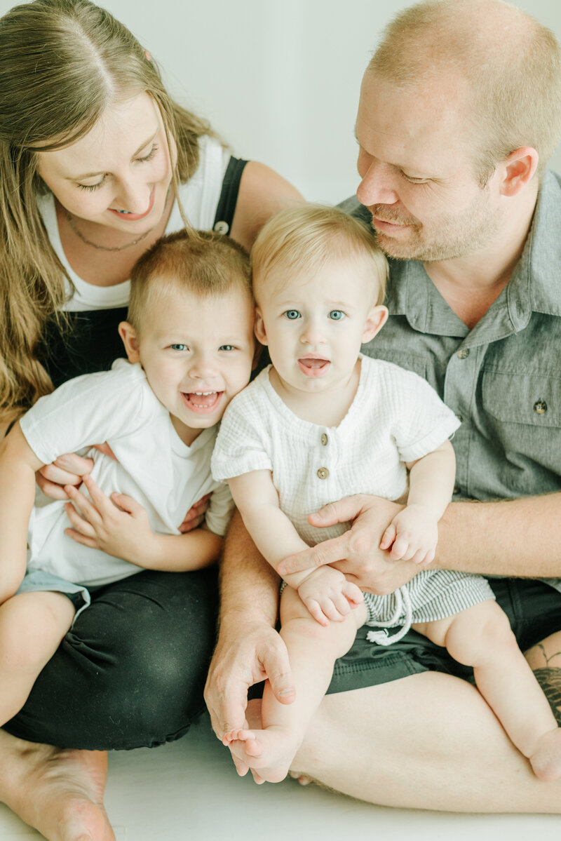 Closeup studio image of a family of 4 in the Redding Ca Studio of Cayton Heath Photography