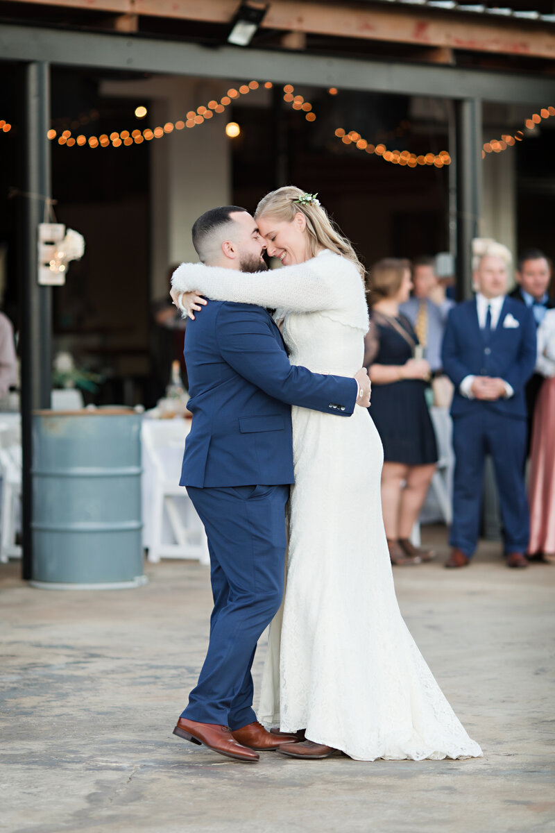 high spring brewing company bride and groom dancing