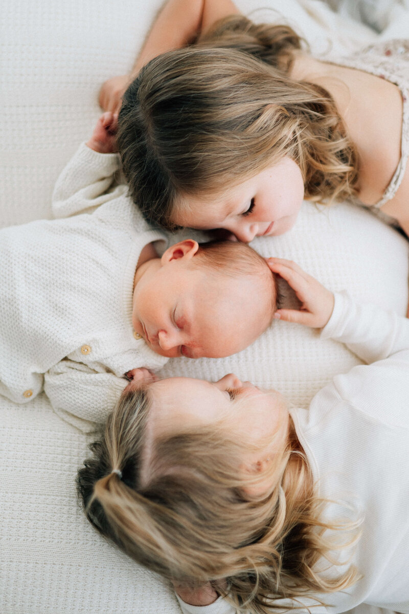 newborn baby held at dad's chest