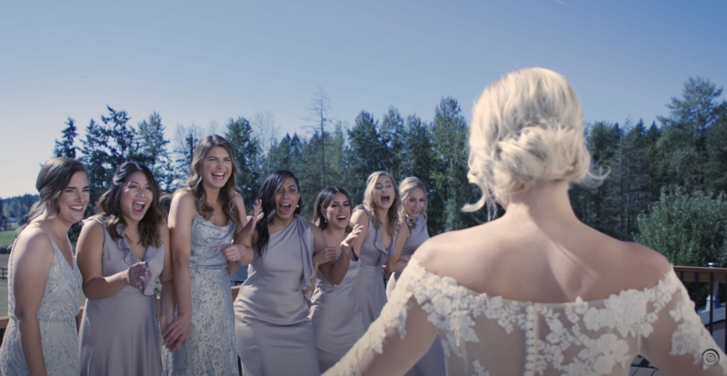 bride having a first look with her bridemaids