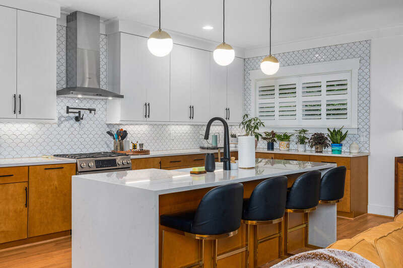 Amazing kitchen design in Birmingham, AL by a registered designer with her NCIDQ. Large island with waterfall countertops.