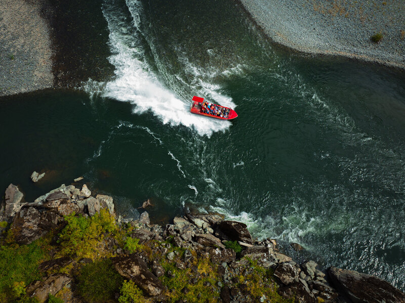 red jet boat on the river