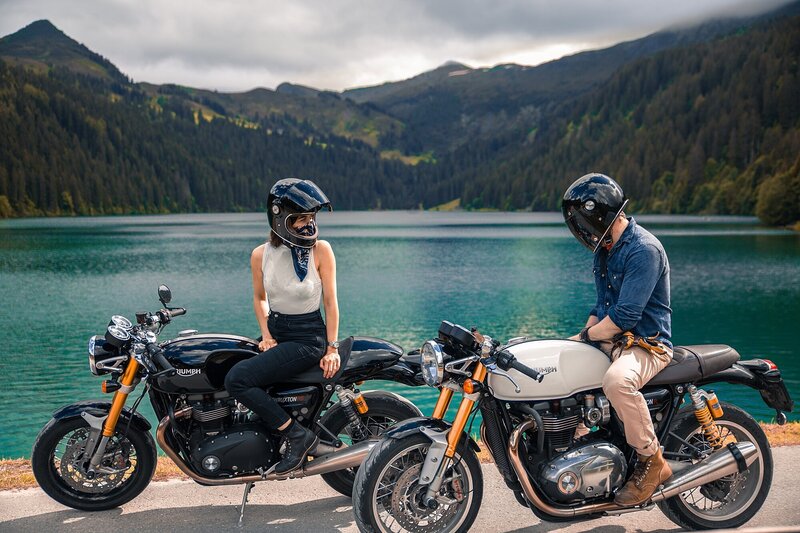 couple enjoy riding motorcycles near the water in Bali