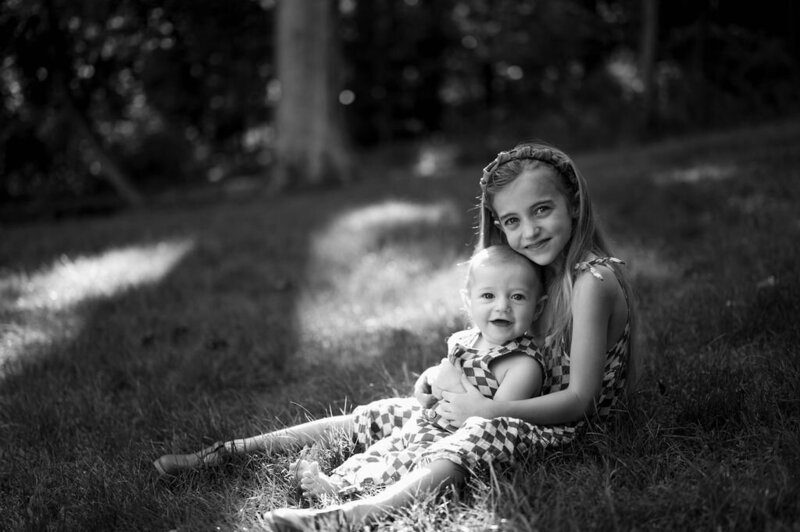 Daughter holding her sibling during a warm family session in Pennsylvania