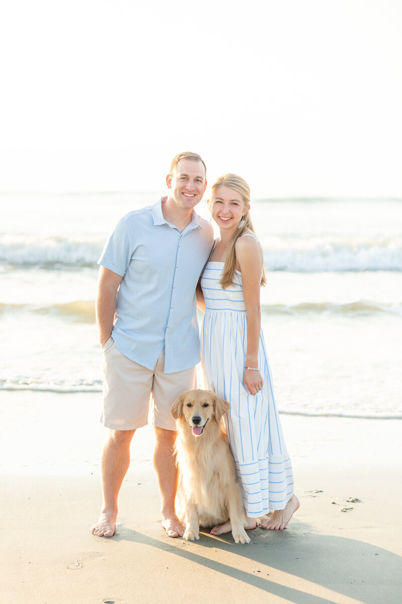 Wedding Photographers in Akron OH tall grass golden hour photography golden retriever and couple photo