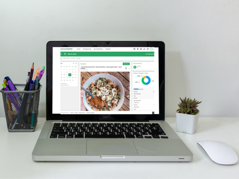 Sports dietitian providing virtual nutrition coaching with a personalized food log and feedback displayed on a computer screen.