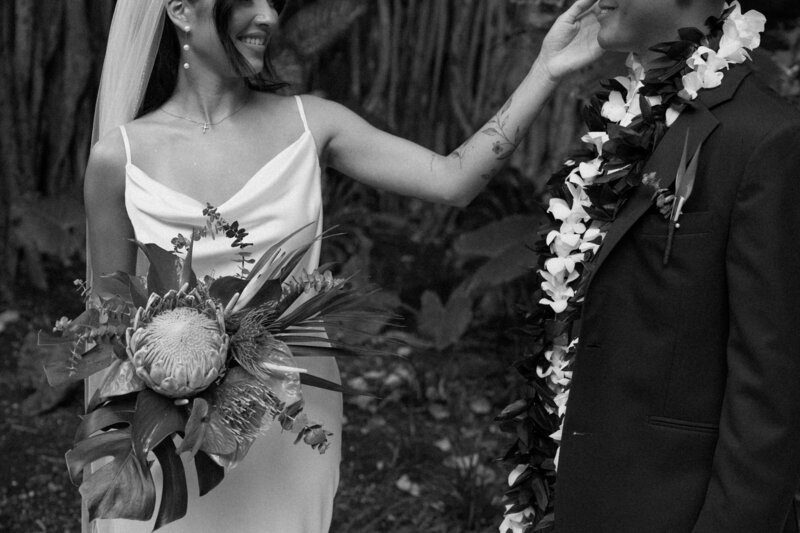 bride touching grooms cheek