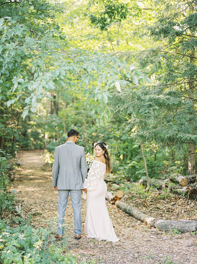 Bride and Groom walking  in forest