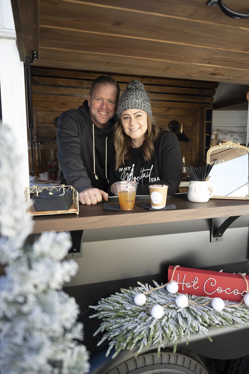 Amy and Gary Pierce standing out side the Cooper & Co Mocktail Trailer