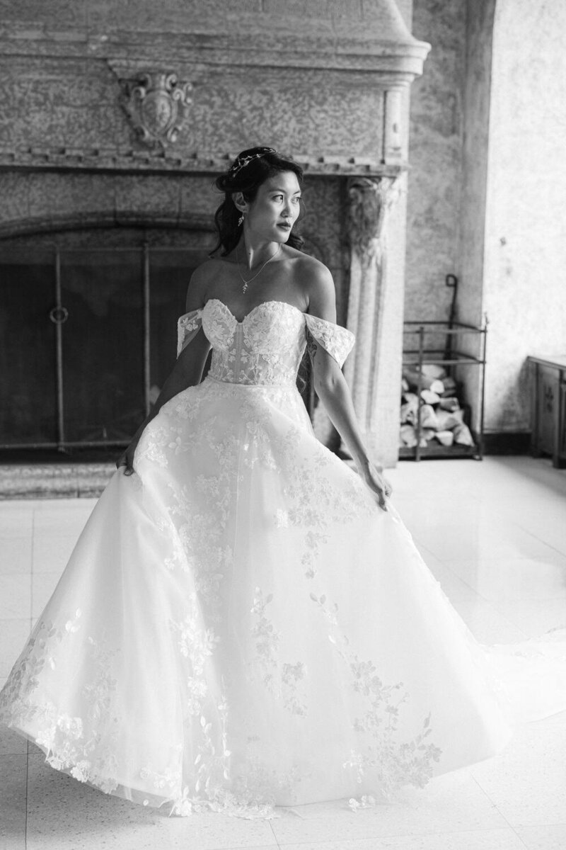 Capture the serene beauty of a bride looking out the grand windows after getting ready at the Banff Springs Hotel. A timeless moment of anticipation and elegance on her wedding day.