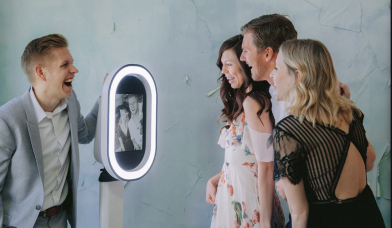 guests posing for the selfie pod photo booth, perfect for private events or events, big or small