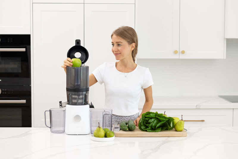 Olivia Budgen using the Nama J2 Juicer, the best cold press juicer for raw vegan and detox lifestyles