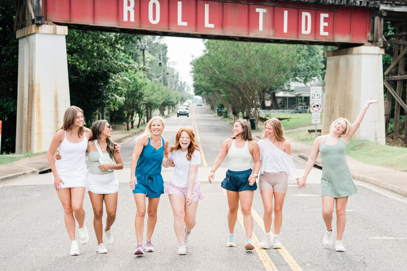 Women walking and smiling in Tuscaloosa
