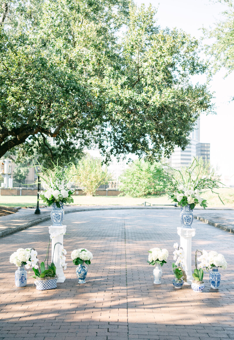 beautiful ceremony decorations with Chinoiserie jars and beautiful florals