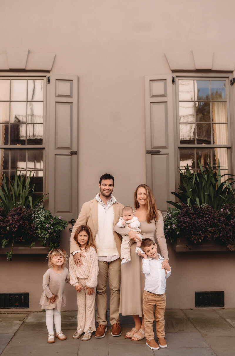 Family poses together for Family Pictures in downtown Charleston, South Carolina.