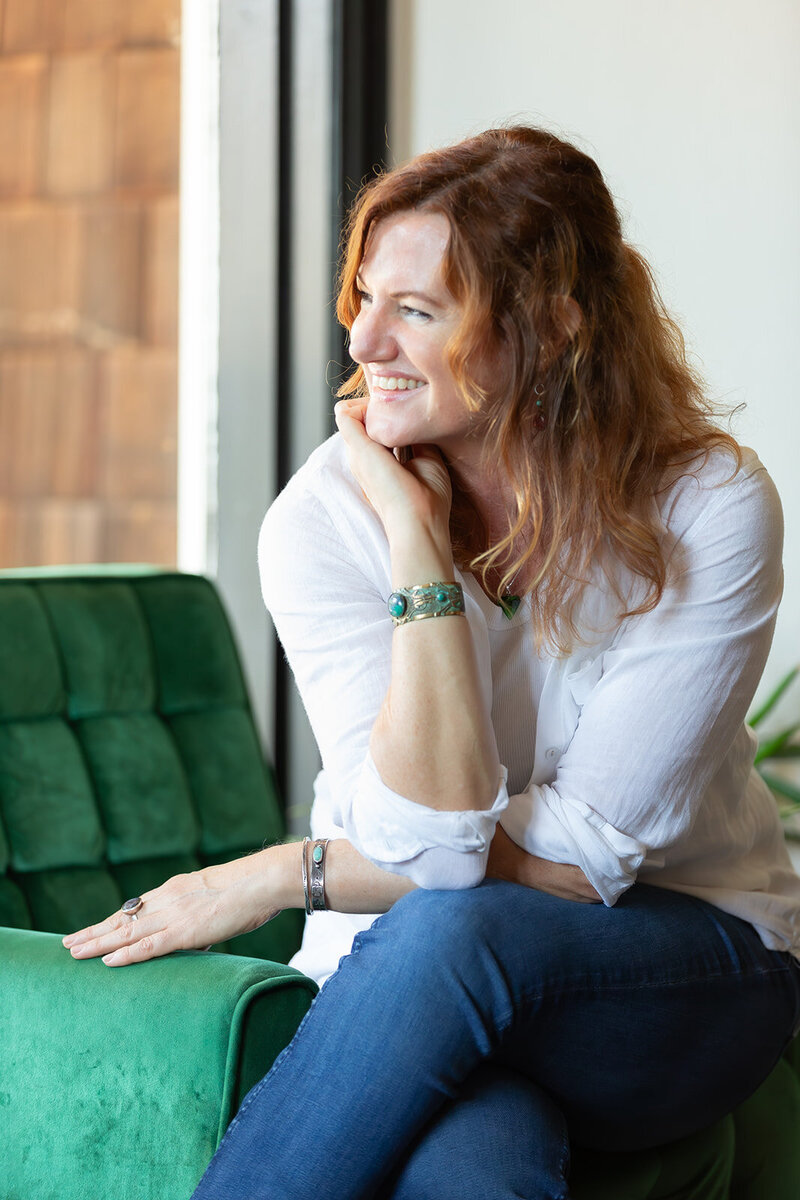 woman on couch smiling