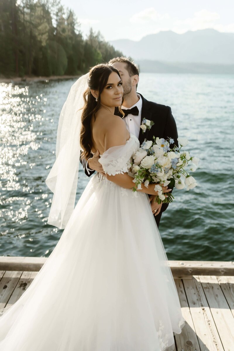 Wedding couple on a cliff captured by Lake Tahoe wedding photographer