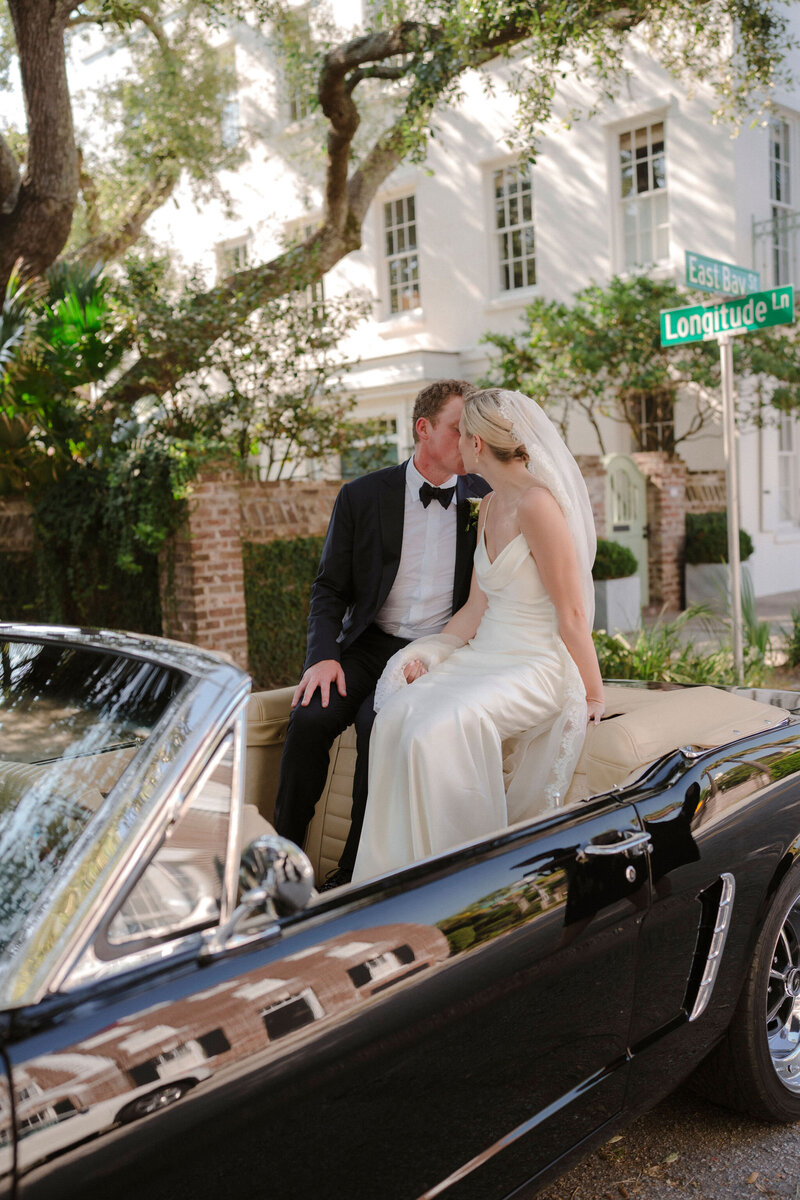 Happy newlyweds in their getaway car, enjoying their wedding day knowing E Stokes Creations ensured their invitations and day-of items were perfect