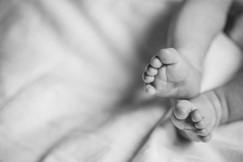 Back and white photo of baby's feet