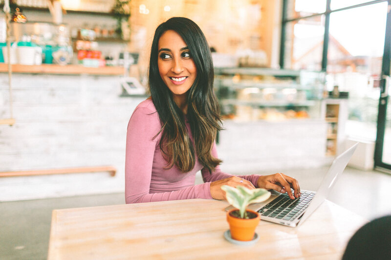 Woman working on computer to illustrate creating Showit websites