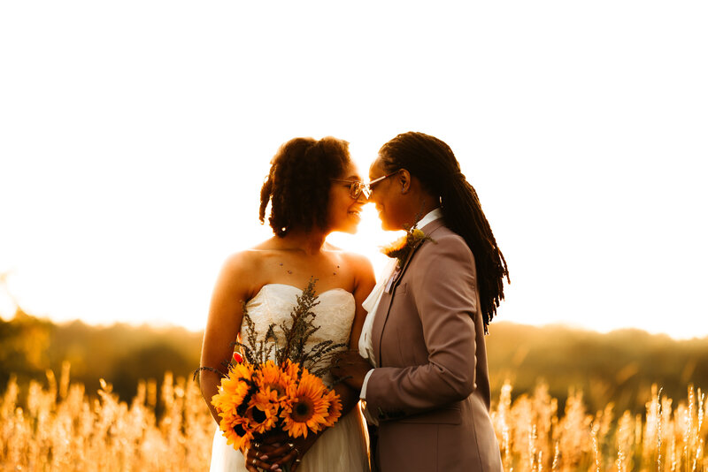 A couple embracing in front of a lake