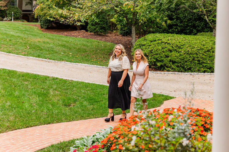 realtors women team walking together toward a house entrance in Atlanta by Laure Photography