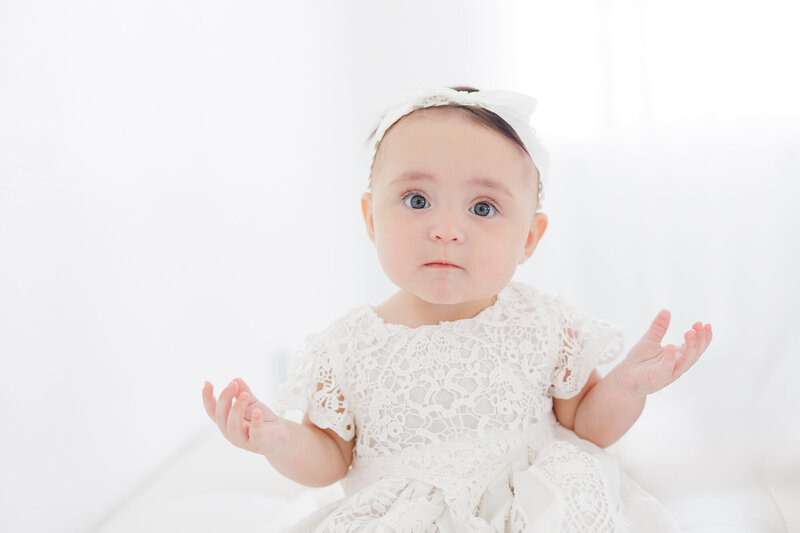 Newborn baby smiling during portrait sesson with Boise Photography Studio Tiffany Hix