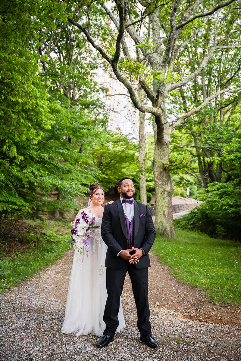 A couple prepares for their first look at Mill Mountain Star in Roanoke, Virginia on their elopement wedding day.