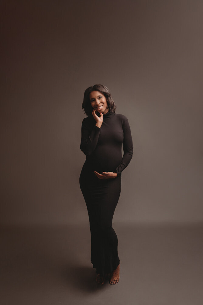 Pregnant woman in black maternity gown at maternity photo shoot with Atlanta, Georgia maternity photographer, Casey McMinn Photography.