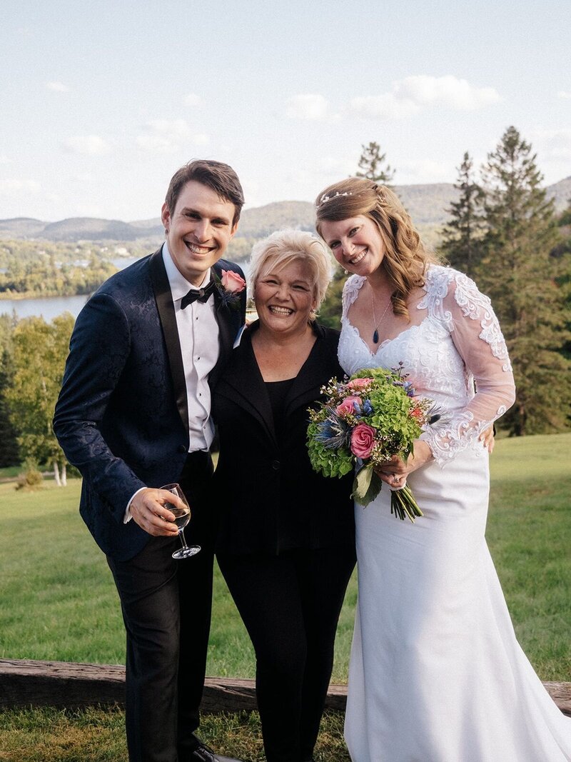 Officiant with bride and groom