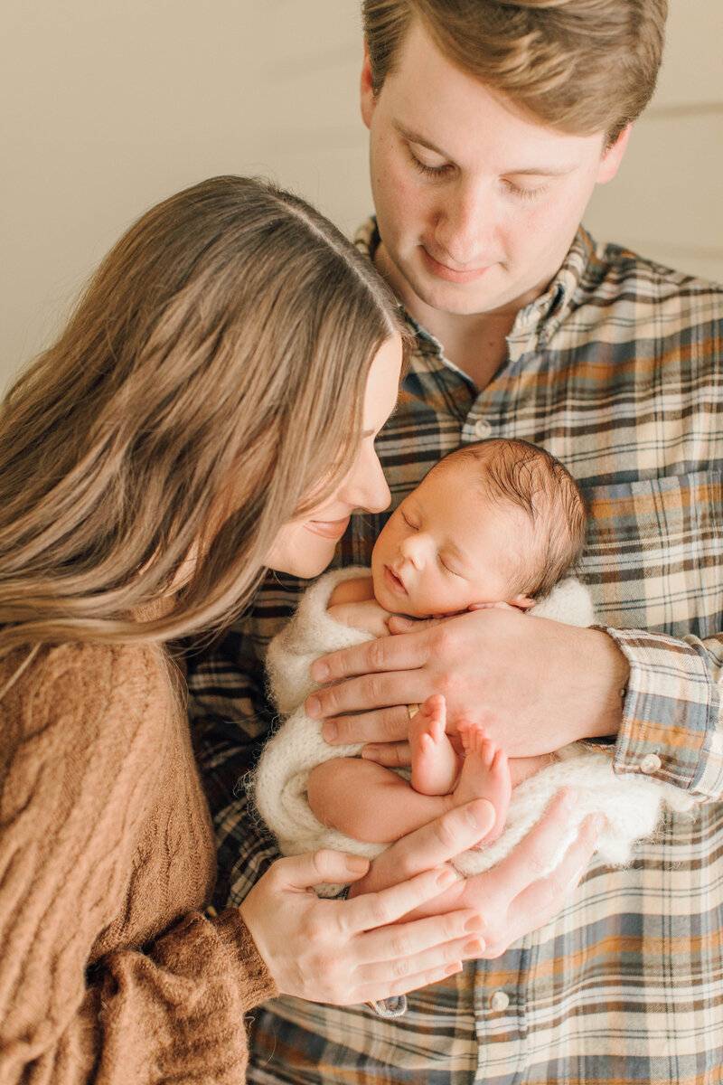 photo of newborn baby with family