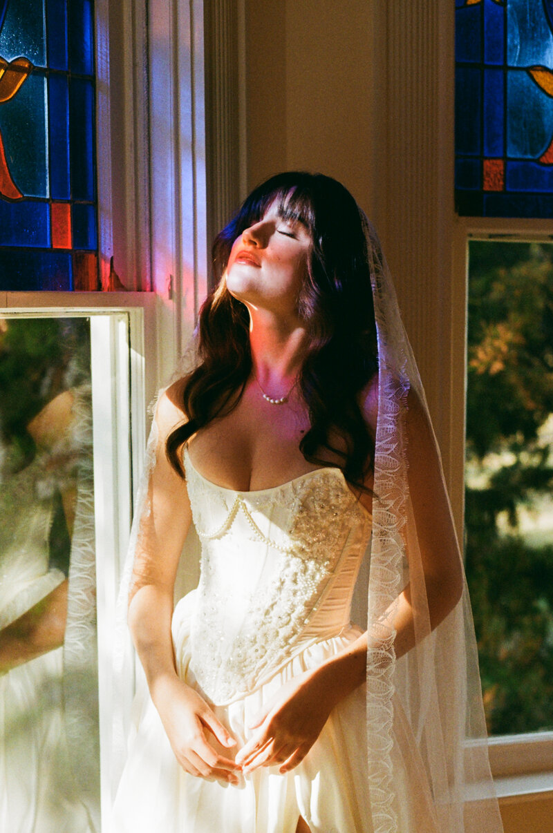 A nostalgic photo of a candlelit tablescape at a wedding reception captured by Southern California film and digital documentary wedding photographer