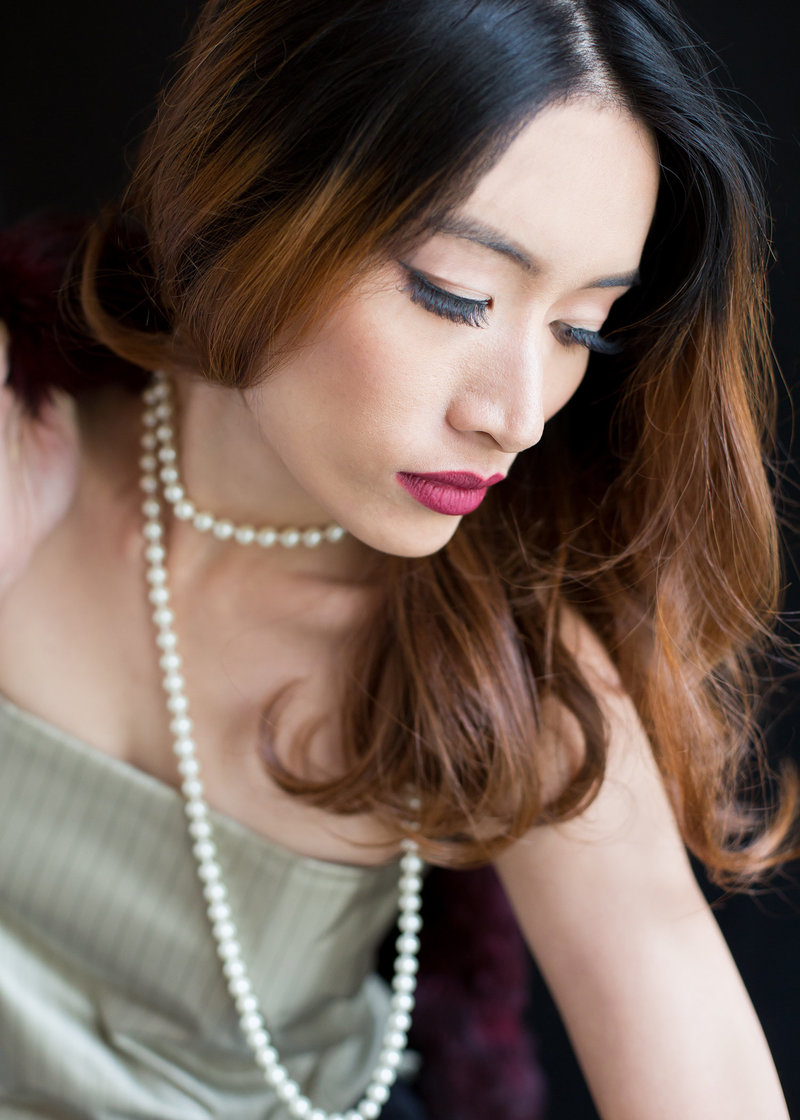 Portrait of an Asian woman wearing pearls