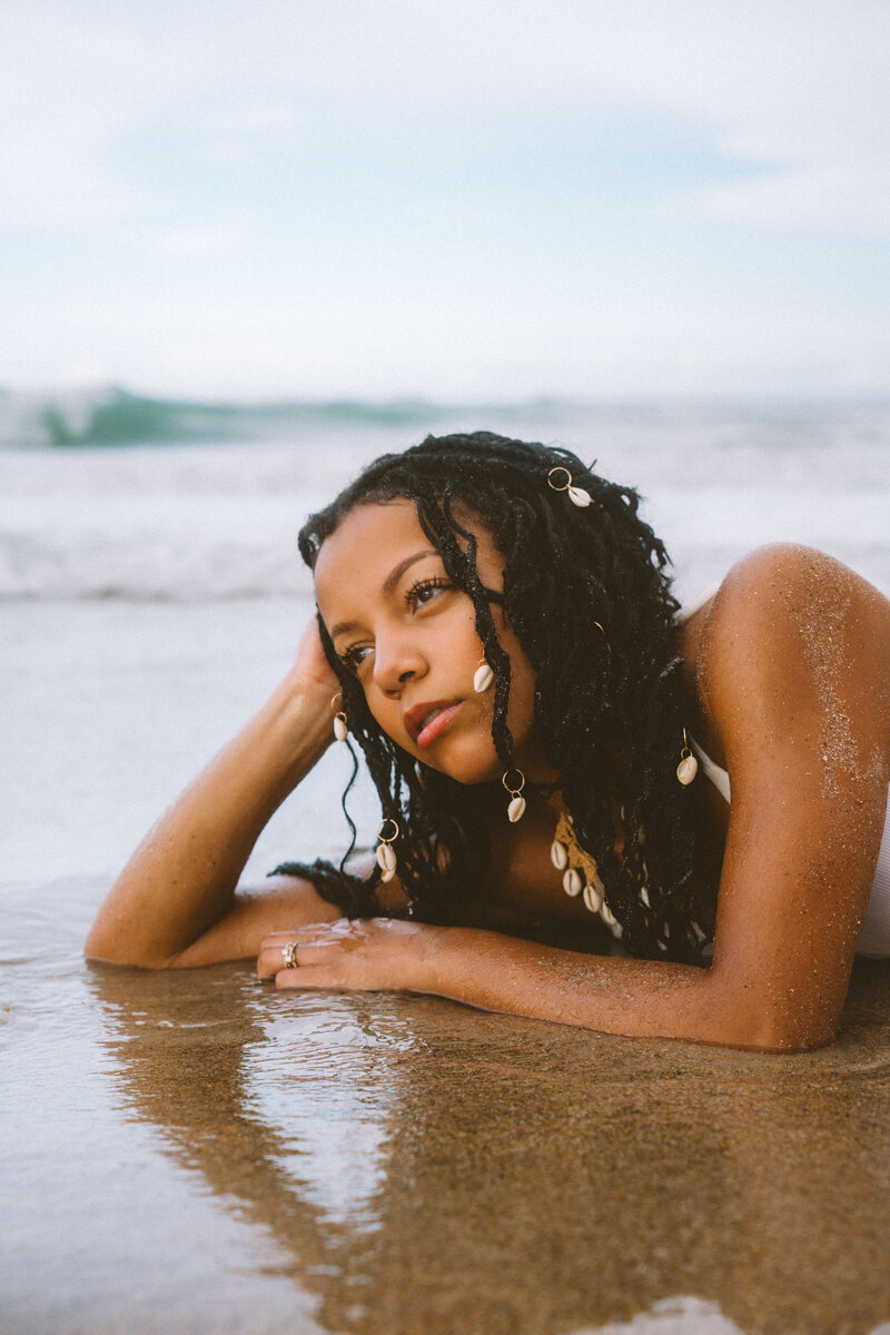 Portrait of girl laying on the beach