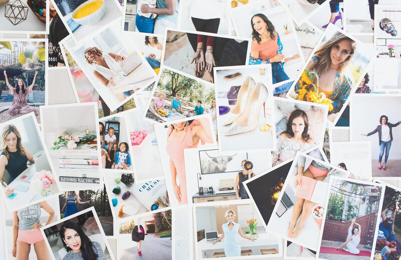 Luxury brand strategist in emerald green blazer reviewing client brand board with custom mood board, color palette, and visual identity elements during strategic design consultation