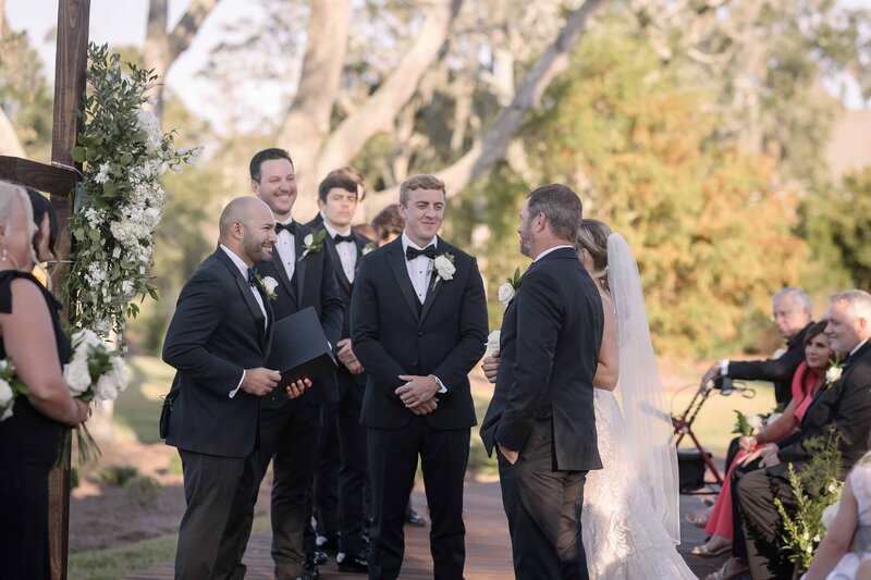 Captured by Phavy Photography, a St. Simon’s wedding photographer, this emotional moment shows the bride being walked down the aisle by her father toward the groom at The Sandpiper in Waverly, GA. With a luxury, documentary style, Phavy Photography highlights the heartfelt moments that define elegant weddings in St. Simon’s and Jekyll Island.