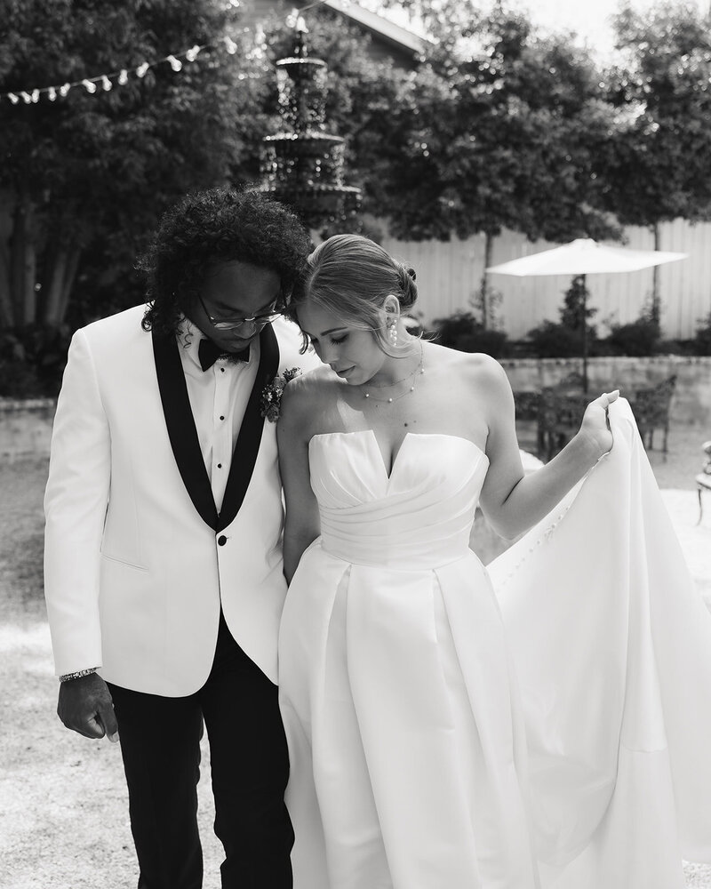 bride and groom holding hands